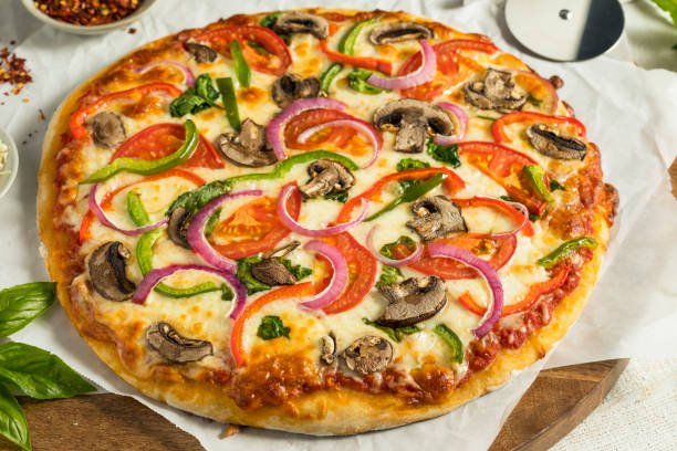 Homemade Veggie Pizza with Mushrooms Peppers Tomatoes and Spinach